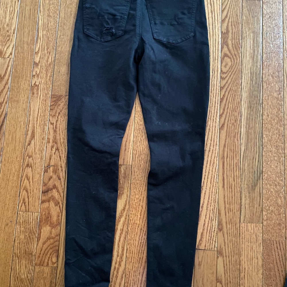 American Eagle black ripped button fly jeans